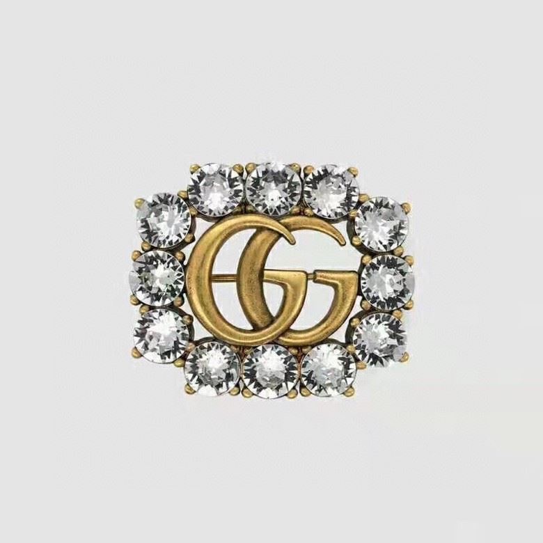 G*u*i brooches